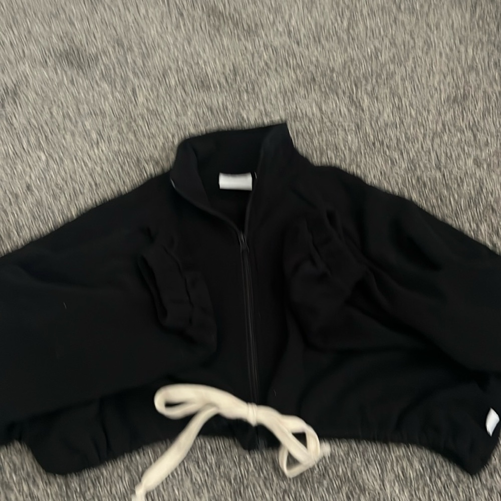 A black cute sweatshirt with little bows and a cute neck line